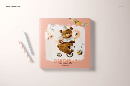 Children’s board book mockup with a soft pink cover and playful bear artwork, displayed flat with birthday props.