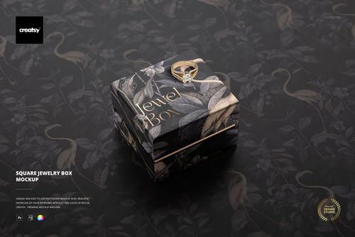 Elegant square jewelry box mockup with leaf and floral design, top-down perspective, gold ring placed on the lid.
