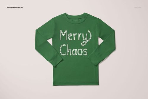 Toddler pajama mockup featuring a green shirt with white lettering, shown flat against a light neutral surface.