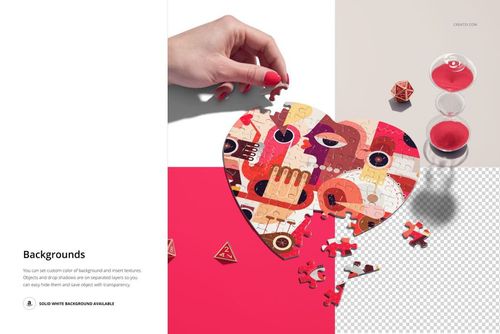 Top view of a heart jigsaw puzzle mockup with vibrant geometric artwork, hand placing a piece on white and pink surface.