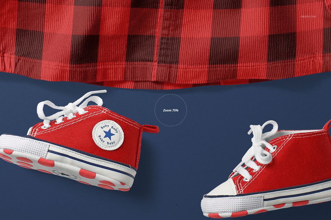 Front view of a baby dress mockup with a red and black checkered pattern, paired with red baby sneakers on a navy background.