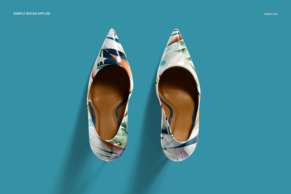 High heels shoes mockup set displaying abstract patterned footwear, top perspective against solid blue backdrop.