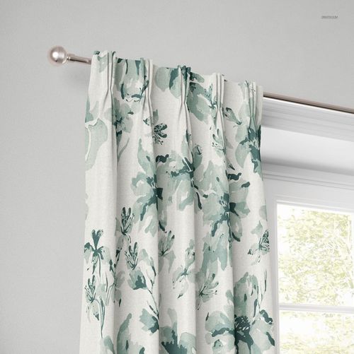 American pleat curtain mockup featuring soft green botanical print, displayed on a window with natural light.