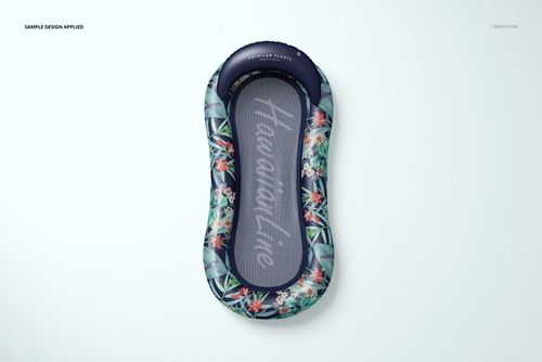 Top view of a pool lounger float mockup featuring dark edges with colorful tropical leaves and flowers.