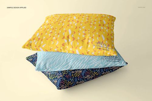 Front view of three decorative pillows with varied designs, displayed as a PSD mockup on a pale backdrop.