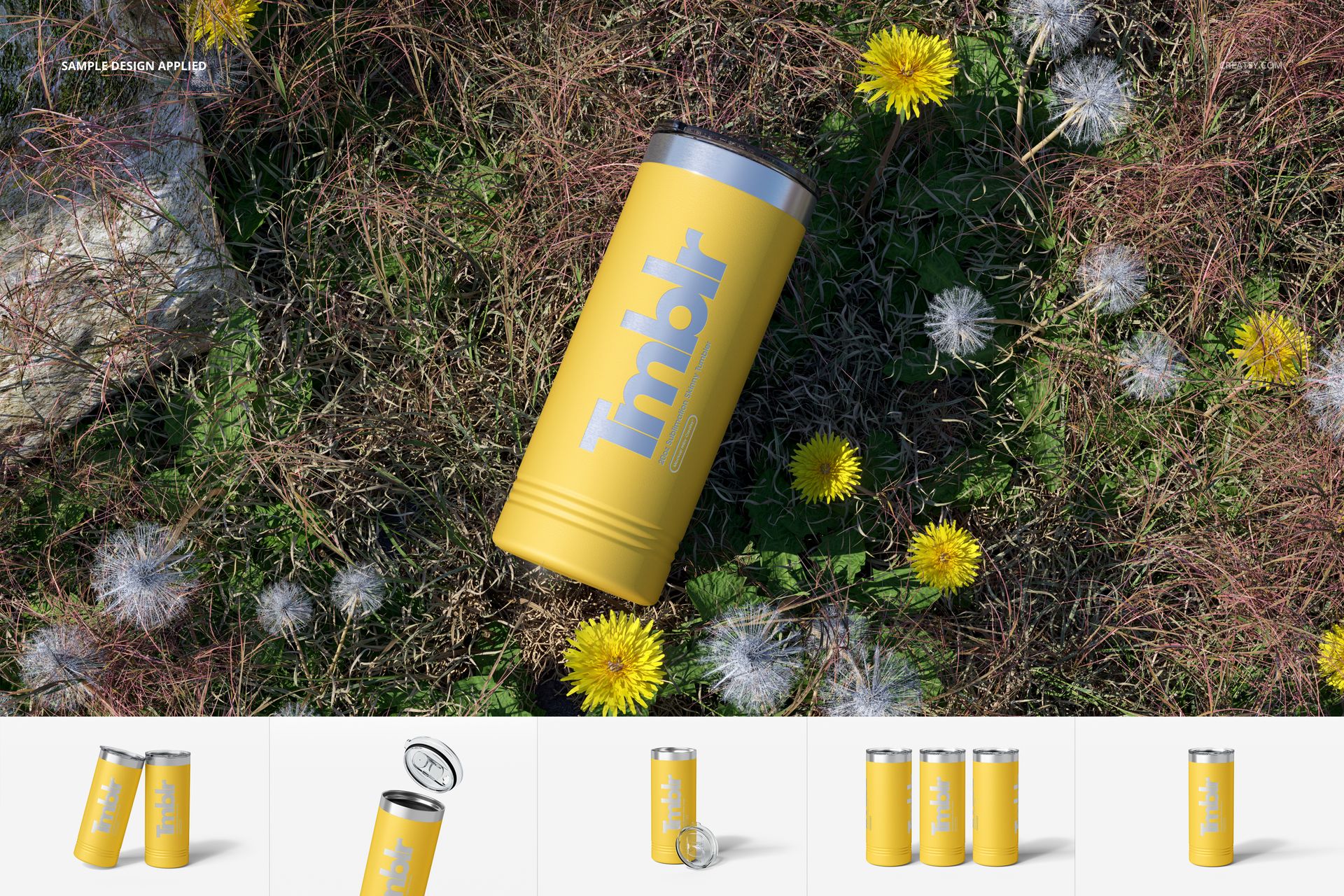 Yellow 22oz skinny tumbler with silver lid lying on grass among dandelions, shown from a top view perspective.