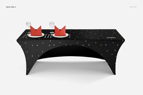 Black stretch tablecloth mockup featuring small colored triangles, two place settings with red napkins and wine glasses.