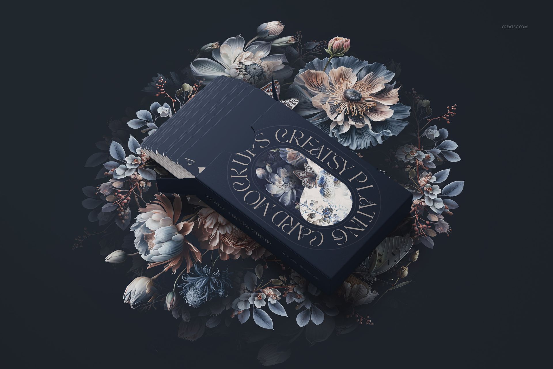 Elegant playing cards mockup featuring navy blue cards with floral artwork, arranged on a dark floral surface.