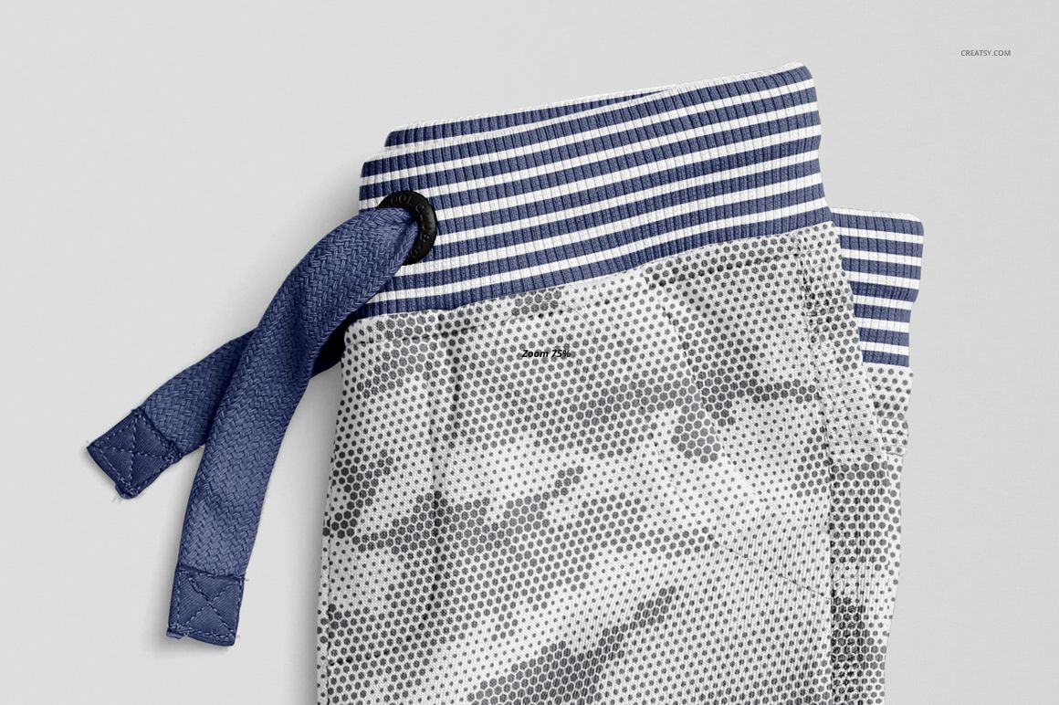Close-up view of baby sweatpants mockup with a blue and white striped waistband and textured fabric detail.