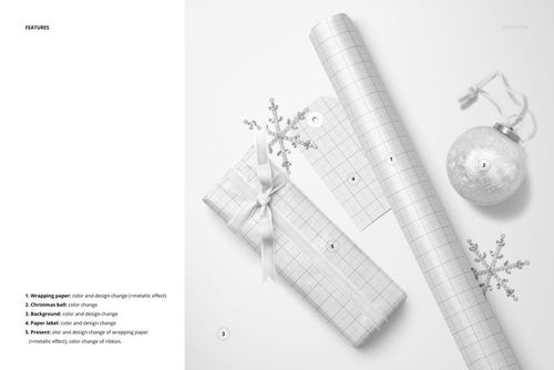Top view of a wrapped gift with ribbon, grid wrapping paper roll, paper label, snowflake ornaments, and bauble mockup.