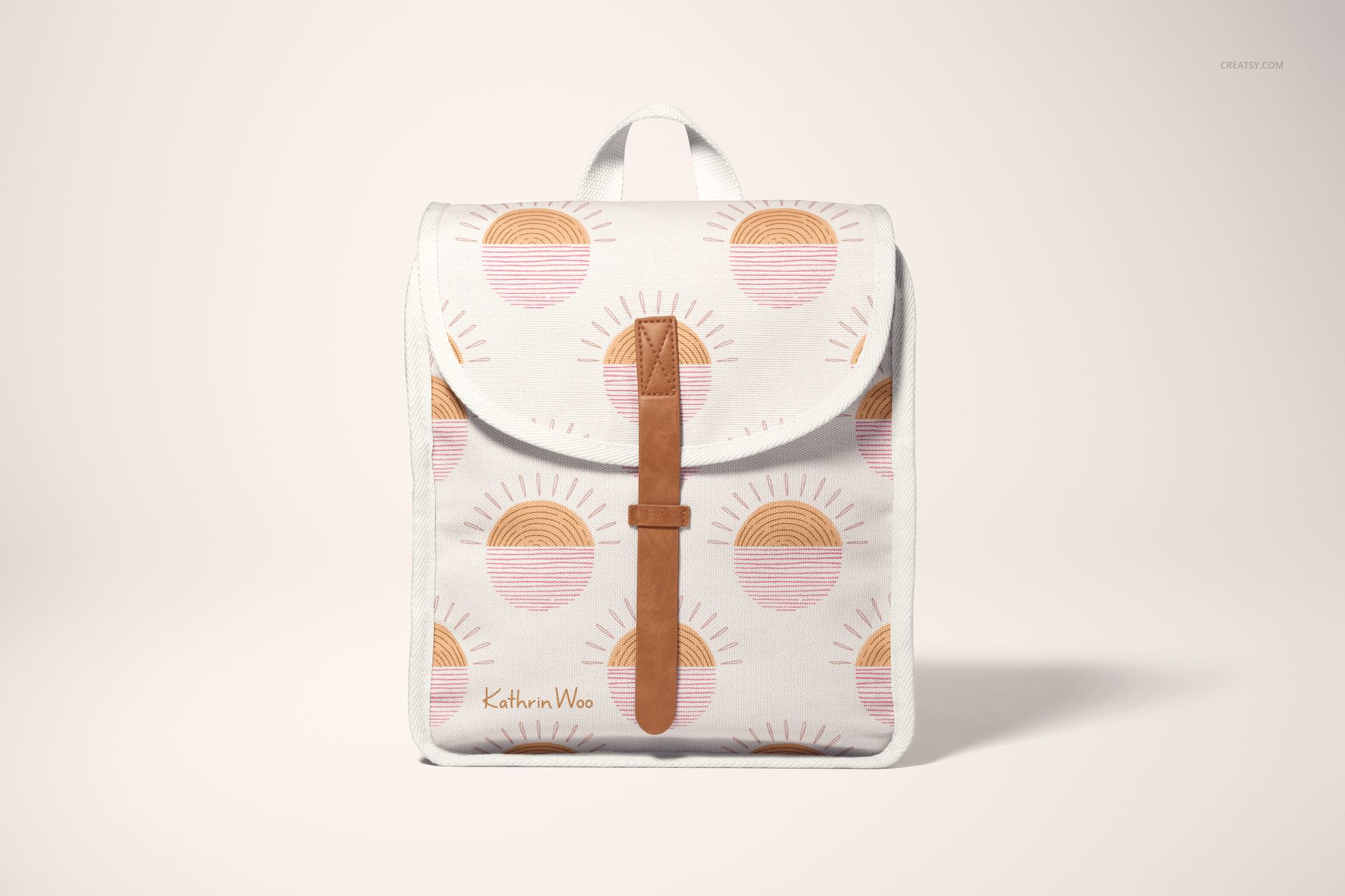 Front view of a kids backpack mockup with a white background, featuring a sun pattern in pink and orange tones.