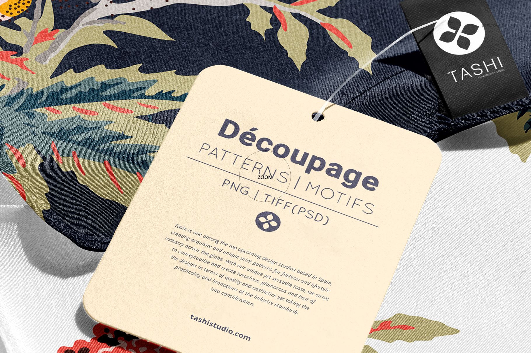 Detailed shot of a silk scarf mockup showing a floral design, attached label, and a square product tag.