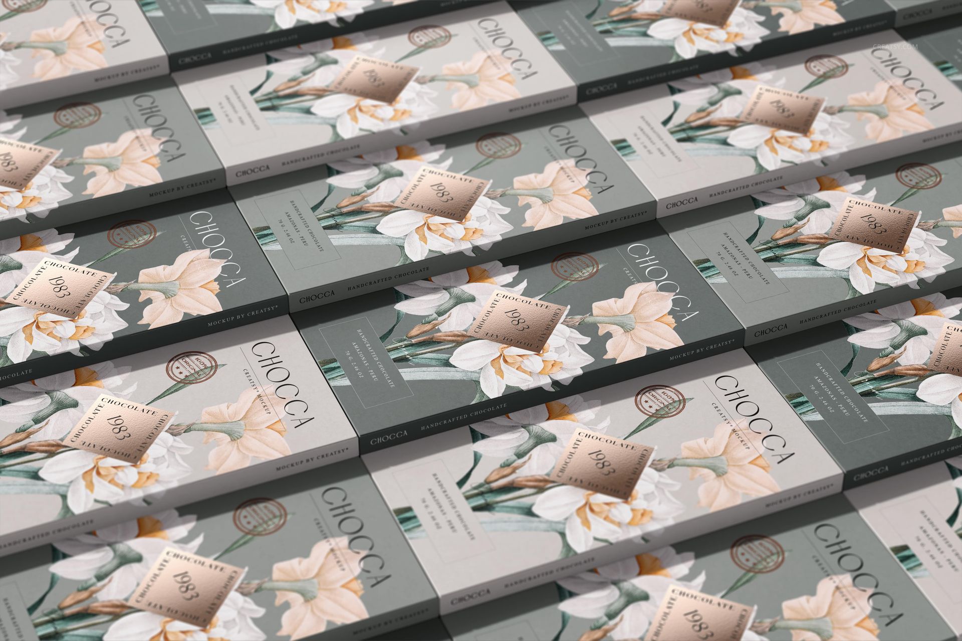 Chocolate bar mockup set showing elegant wrappers with botanical designs, viewed from a slightly elevated perspective.