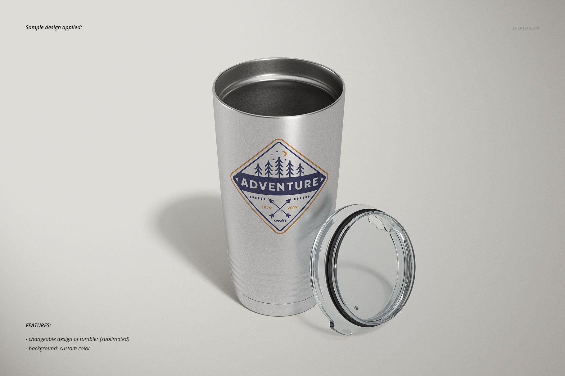Stainless steel tumbler with a clear lid, featuring a geometric adventure-themed logo, shown on a light background.