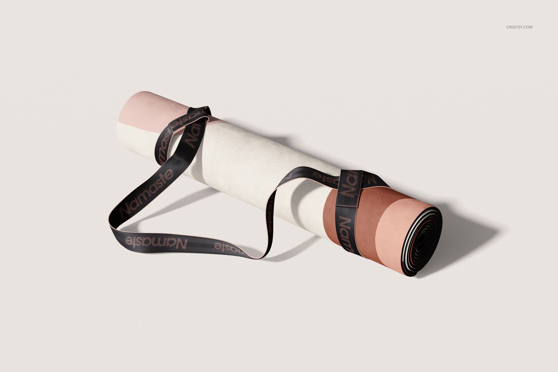 Microfiber suede yoga mat mockup featuring a rolled mat with pastel color sections and a black carrying strap.