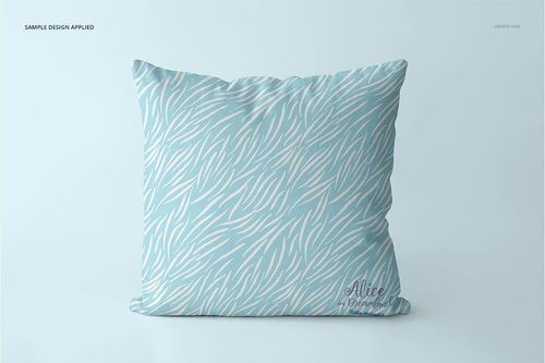 Front-facing mockup of a square pillow featuring a blue base with white organic line design, minimal setting.