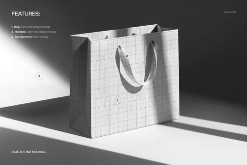 Front view of a premium paper bag mockup with grid pattern, sharp sunlight casting strong shadows on a plain surface.