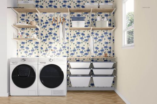 Front view of a laundry room mockup featuring floral wallpaper, wooden shelves, baskets, and white laundry bins.