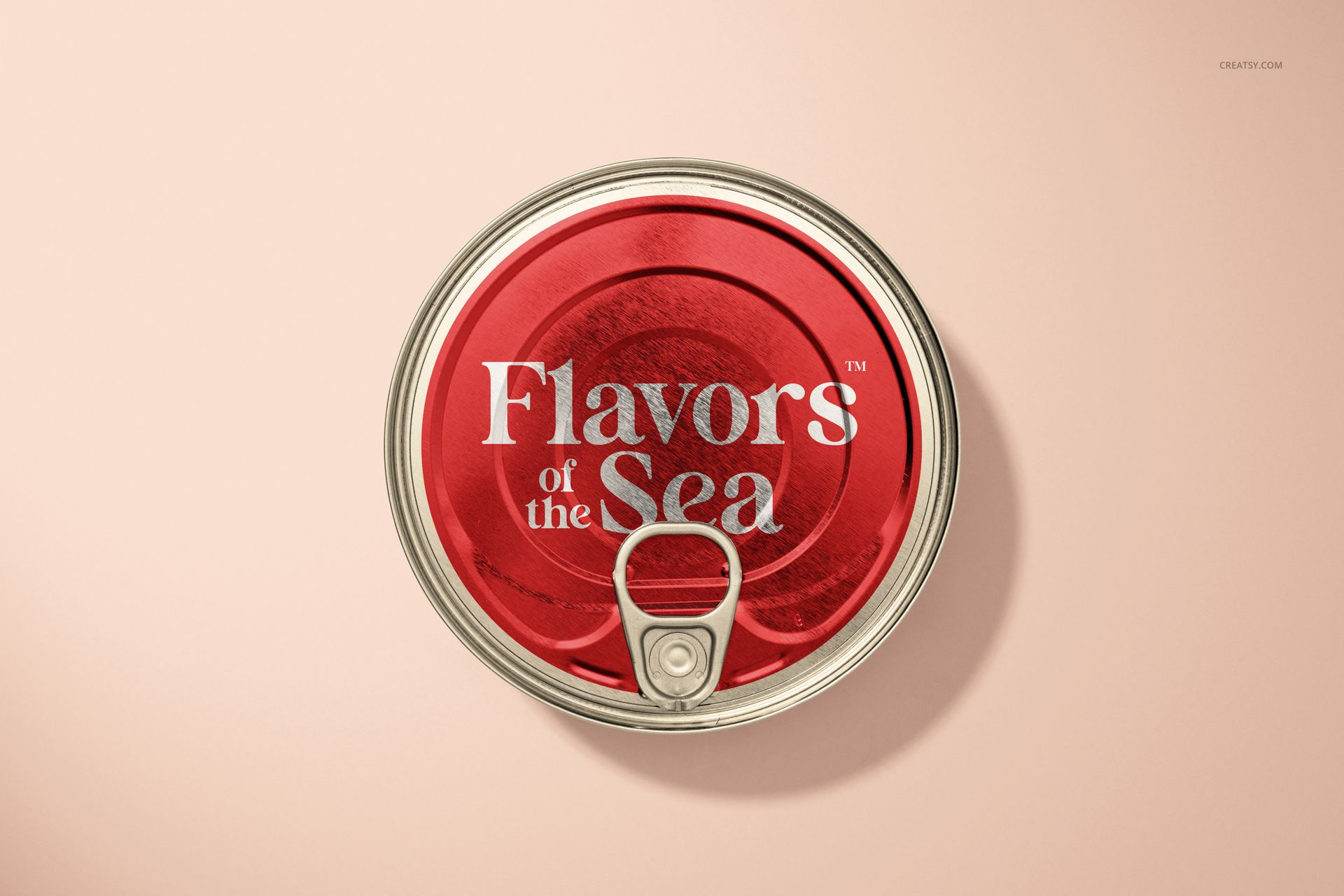 Top view of a round tin can mockup with a red lid and silver pull tab, placed on a neutral surface.