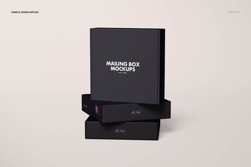 Front view of three black mailing boxes with white text, stacked on a light background in a packaging mockup.