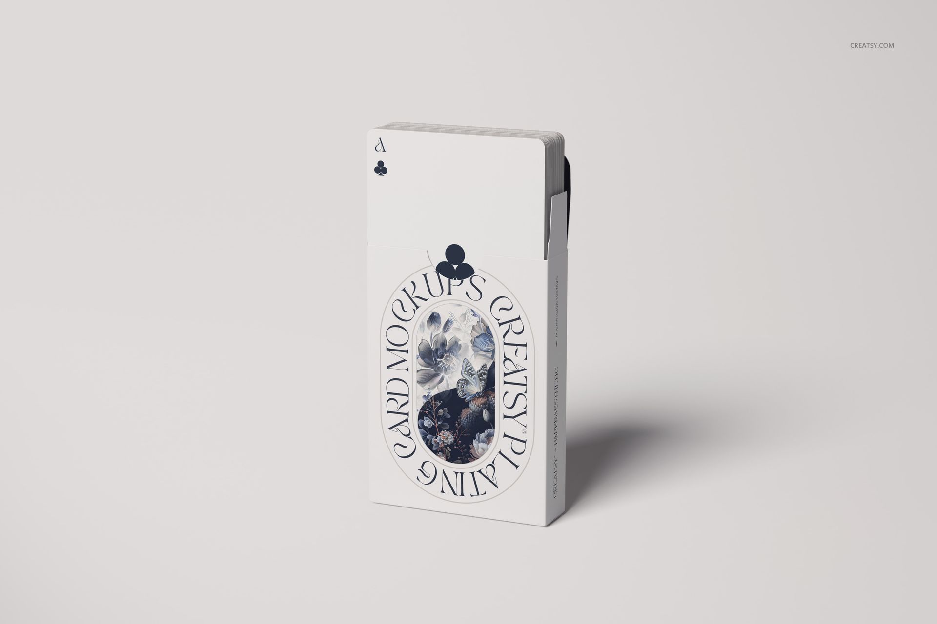Minimalist playing cards mockup showing a box with blue artwork and a partially exposed ace of clubs card.