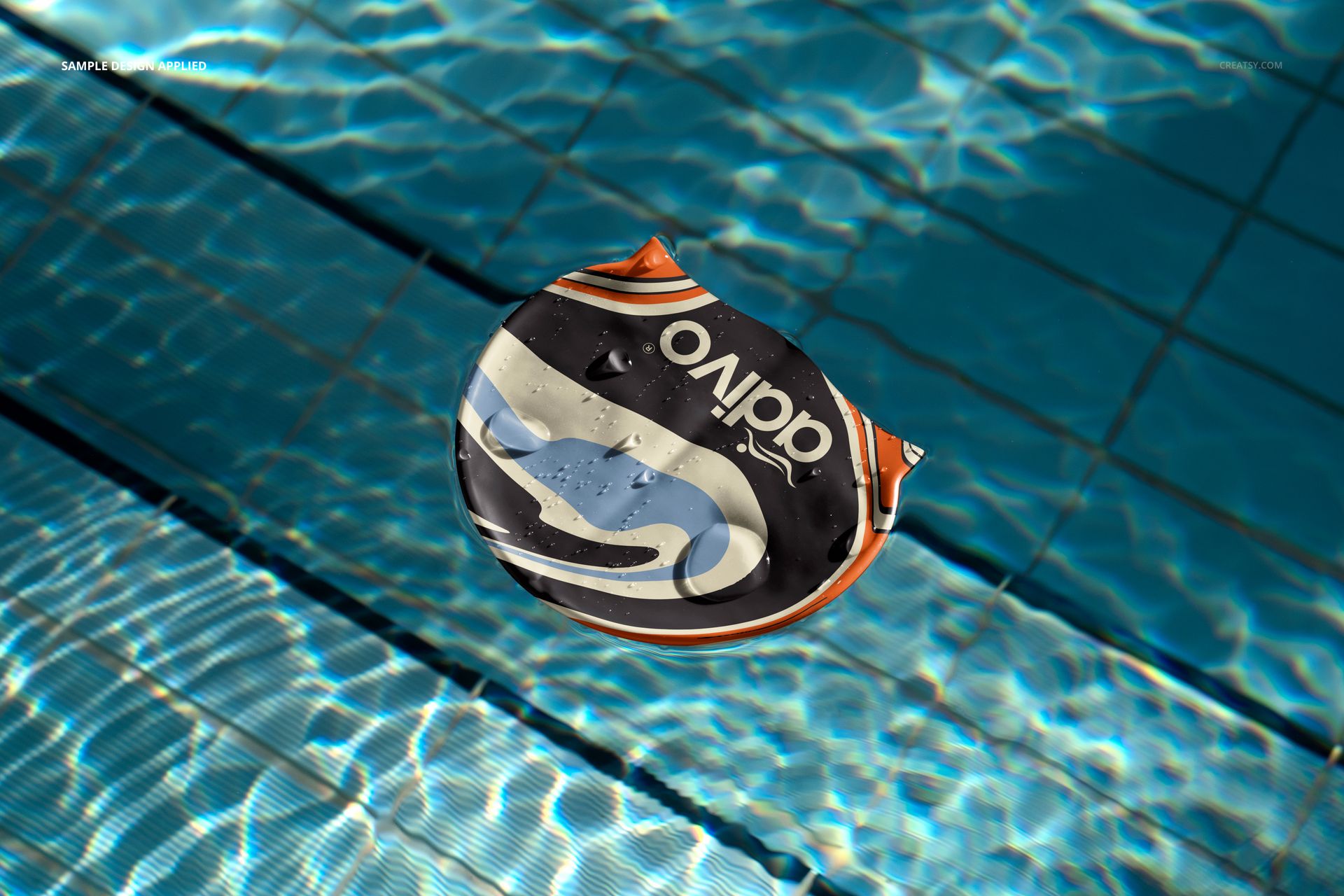 Mockup of a swim cap featuring bold graphic design, floating in a swimming pool with rippling water surface.