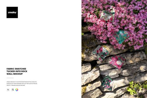 PSD mockup showing multiple patterned fabric swatches inserted into a rustic stone wall, accented by bright pink blossoms above.