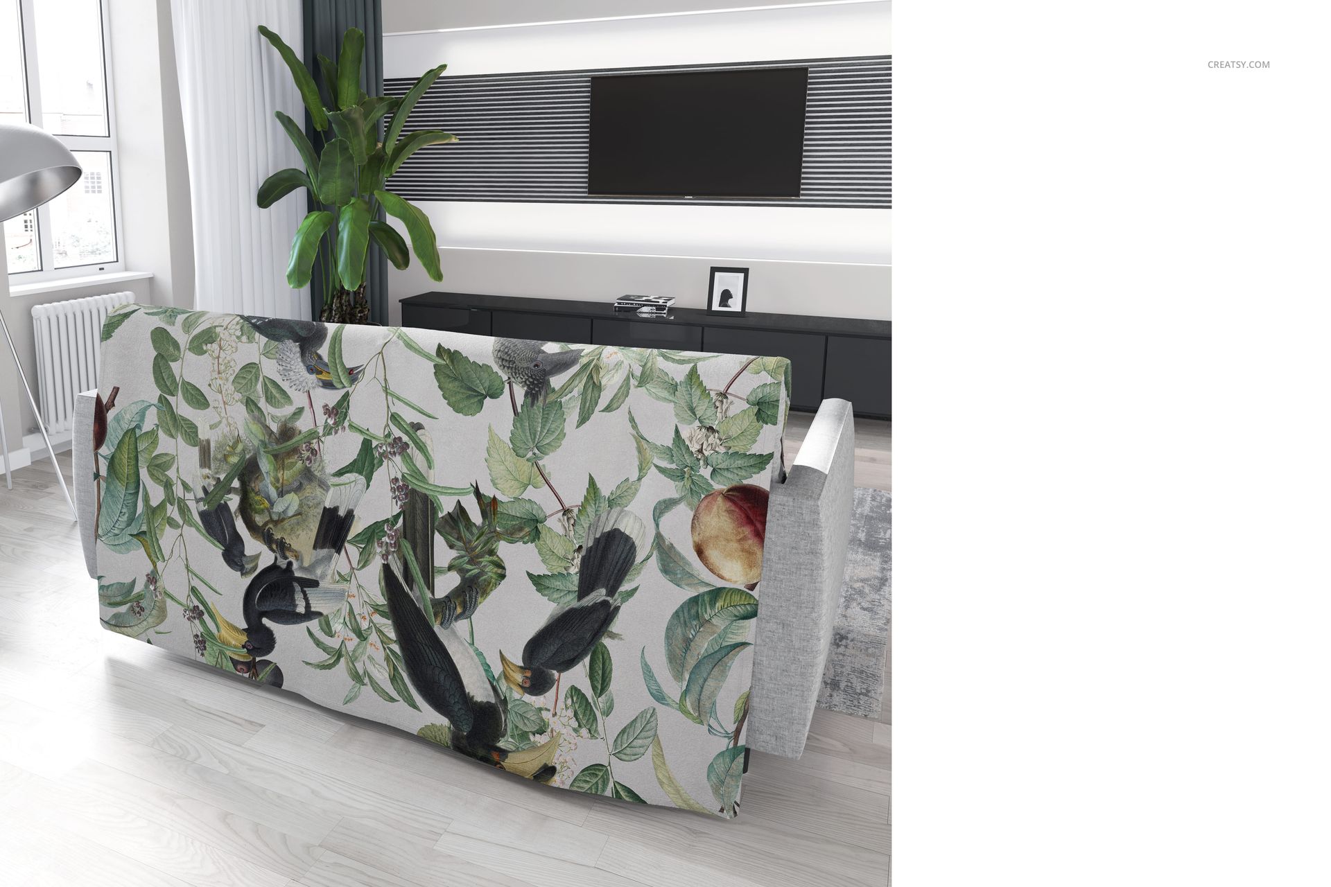 PSD mockup of a couch coverlet displaying a nature-inspired design with foliage and fruit, seen from the rear angle.