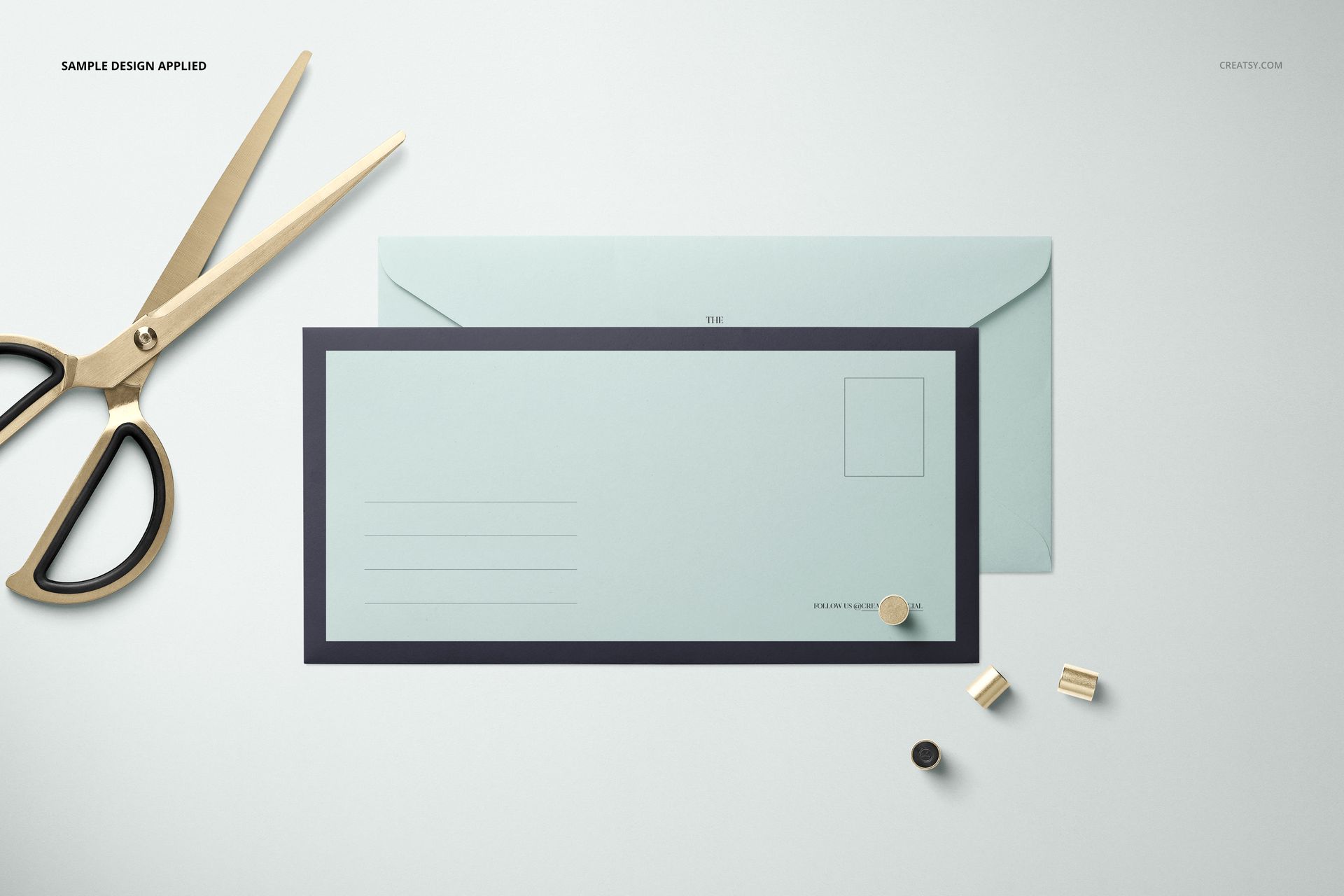 DL envelope mockup set with a light blue envelope and matching mailer, shown from a top view on a light surface.