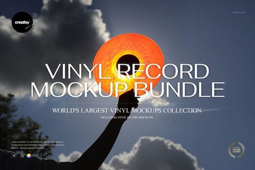 Hand holding an orange transparent vinyl record against a blue sky with clouds, viewed from below in bright sunlight.