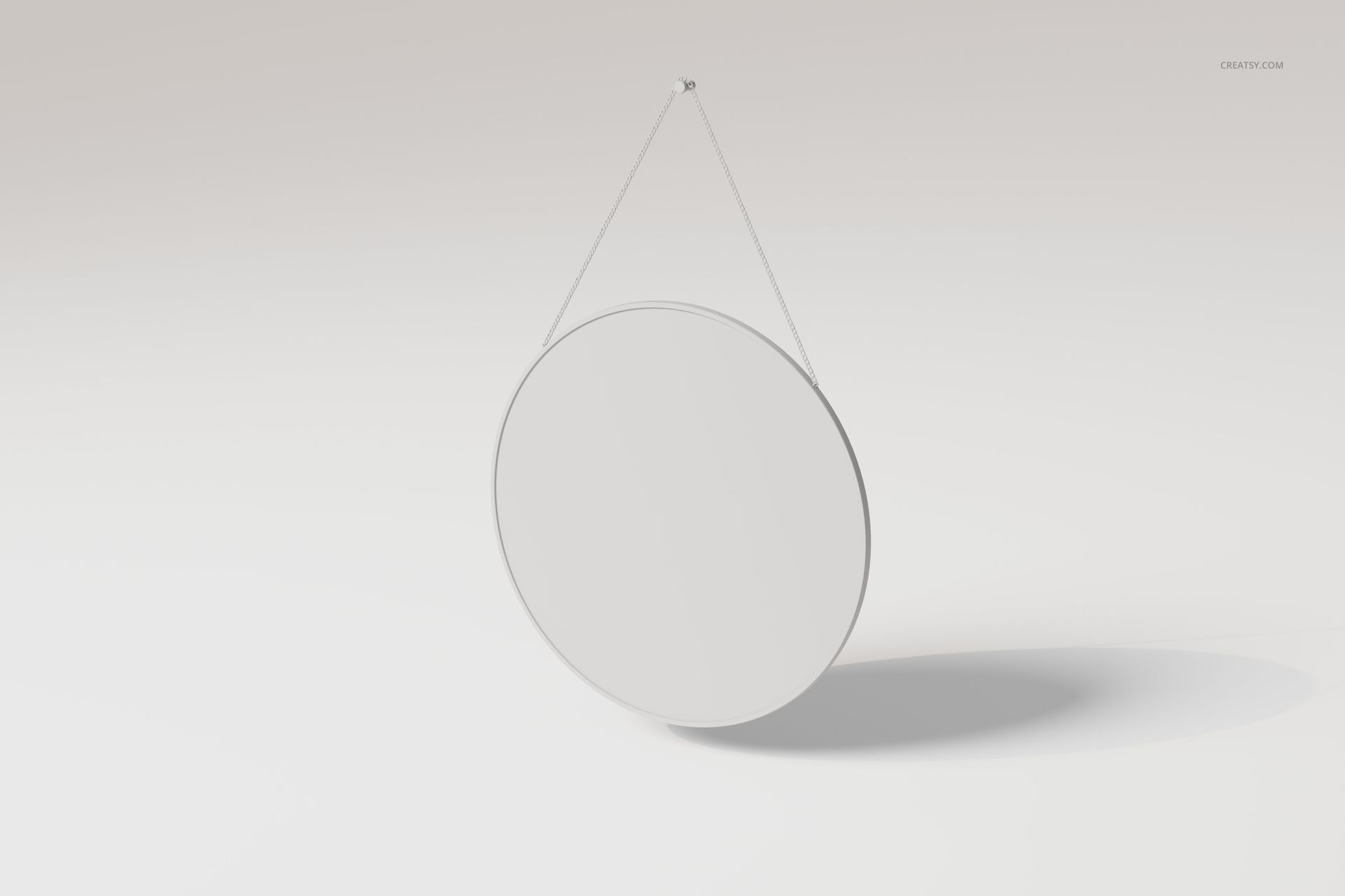 Round wall mirror with a thin frame, suspended by a metal chain, shown from a front angle on a light background.