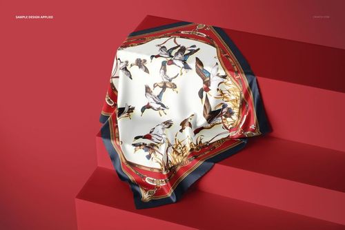 Elegant silk fabric mockup displayed on red steps, showing a bird-themed design with gold and red accents.