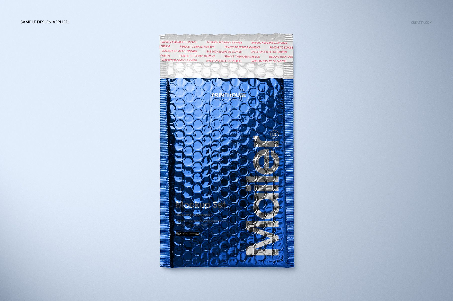 Front view of a metallic bubble mailer mockup in blue with a silver bubble texture, set against a light background.