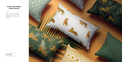 Fabric PSD mockup showing an assortment of patterned pillows with animal, leaf, and abstract motifs on a neutral background.