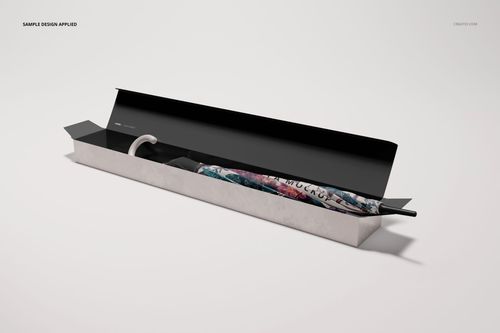 Front angled view of an umbrella packaging mockup set showing a white box with a partially visible patterned umbrella.