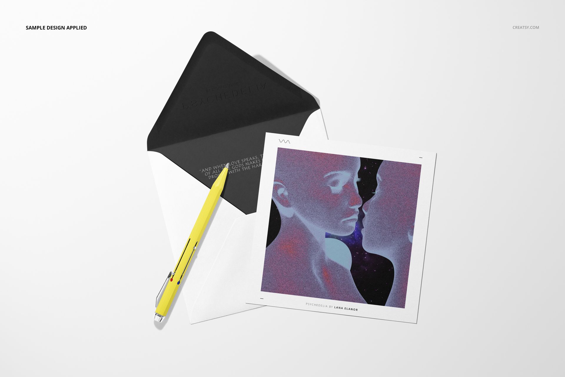 Stationery mockup featuring a square card with colorful design, open envelope, and yellow pen, seen from above.