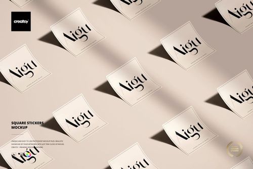 Multiple square stickers featuring simple black lettering scattered across a neutral background in a PSD mockup scene.