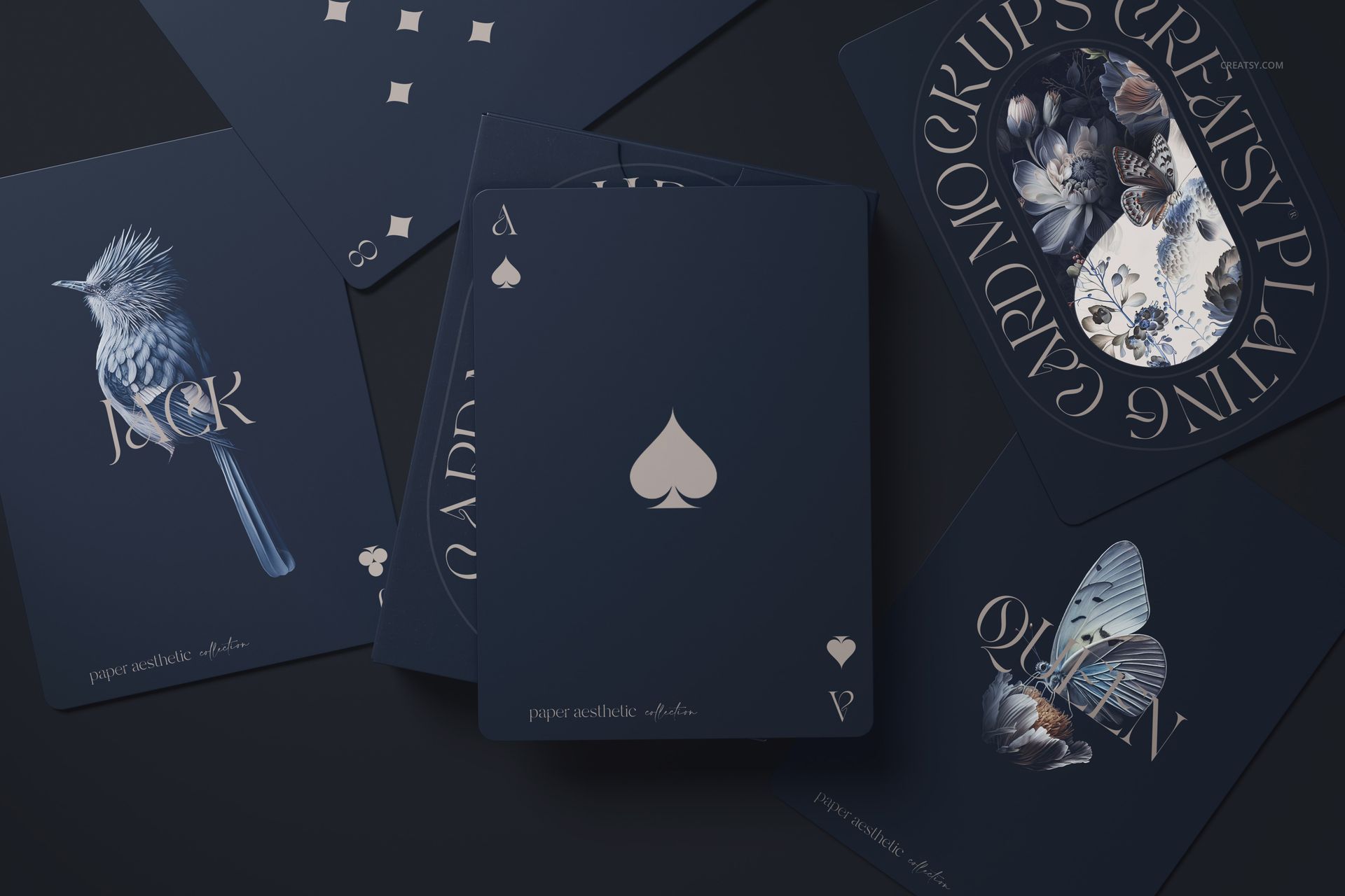 PSD mockup of playing cards arranged on a dark surface, showing unique blue-toned artwork and classic suit symbols.