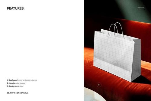 Shopping bag mockup with grid pattern placed on an orange velvet sofa, shown in angled side view with dramatic lighting.