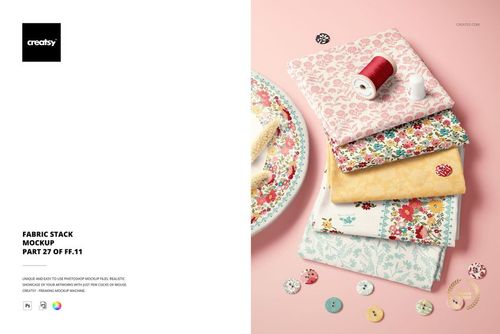 Fabric stack mockup showing folded textiles in floral and geometric prints, viewed from above with sewing props.