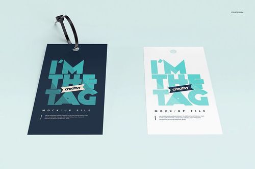 Cable tie tag PSD mockup set featuring two tags, one navy and one white, displayed side by side on a pale surface.