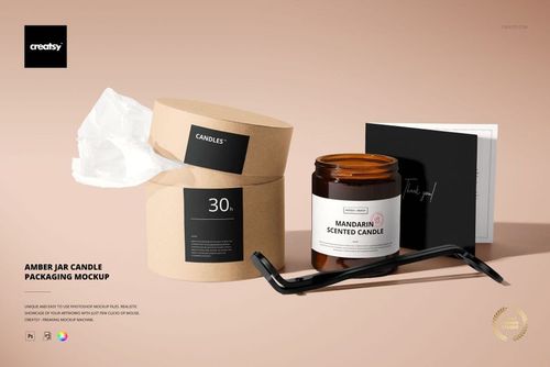 PSD mockup featuring a mandarin scented amber jar candle, kraft paper packaging, and black accessories on a beige background.
