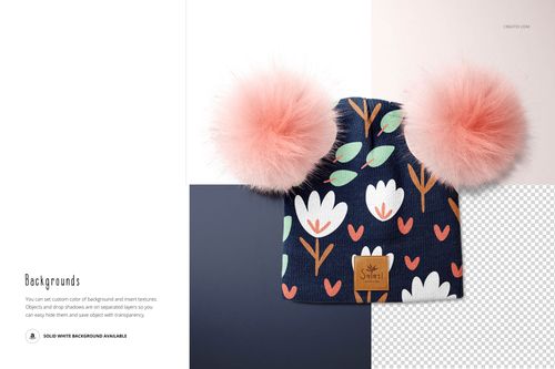PSD mockup of a children’s beanie with fluffy pink pompons and colorful flower design, shown from the front.