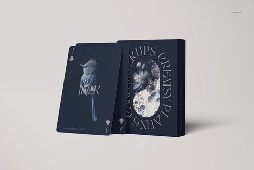 PSD mockup showing stylish playing cards with a bird design and a coordinating box, displayed against a plain backdrop.