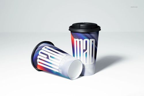 Paper cup mockup set showing two cups with colorful gradient patterns and prominent white lettering on a light surface.