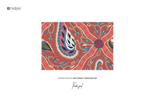 Rectangular fabric mockup featuring a vibrant paisley pattern in red, blue, green, and gold tones, viewed from above.