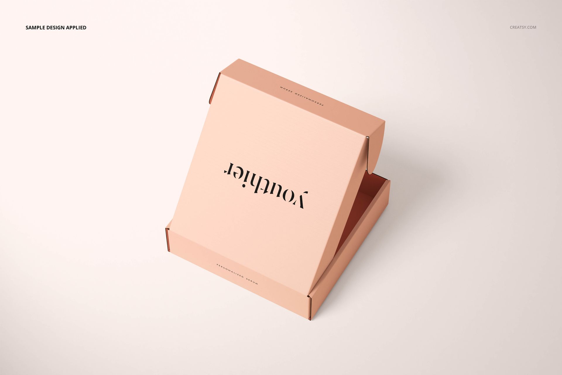 Peach-colored cosmetic mailing box mockup displayed at an angle, lid partially lifted, on a minimalist surface.