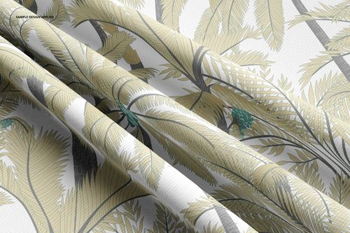 Close-up of rib knit fabric mockup featuring overlapping folds and a leafy botanical design in muted colors.