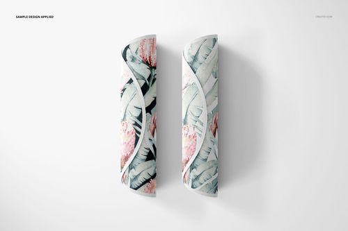 Two knitted round rug mockups featuring pastel botanical designs, shown rolled up against a plain white surface.