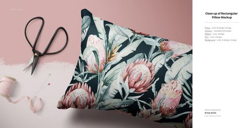 Floral fabric pillow mockup shown from a front angle, with sewing tools and pink background for a creative scene.